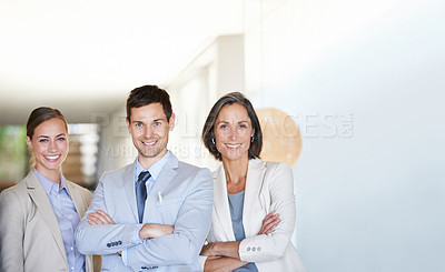 Buy stock photo Portrait of three successful and happy businesspeople standing together