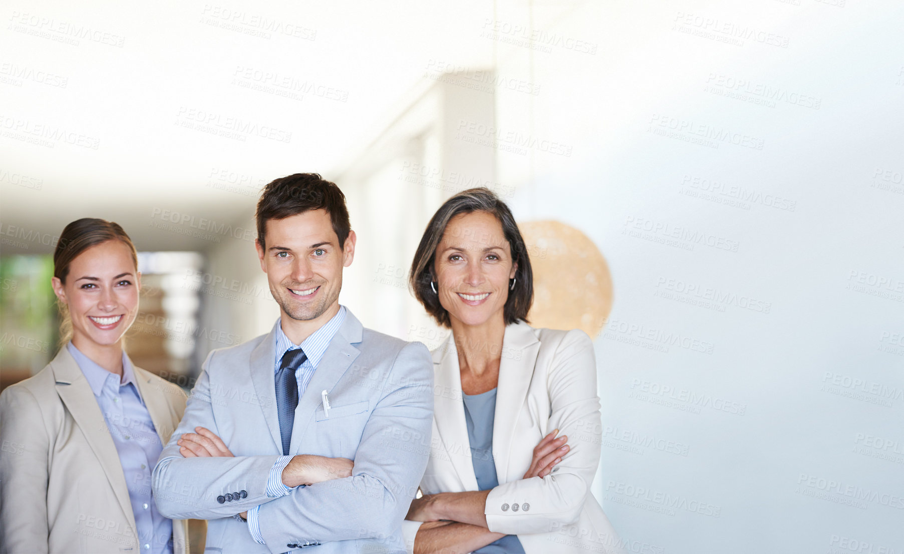Buy stock photo Portrait of three successful and happy businesspeople standing together