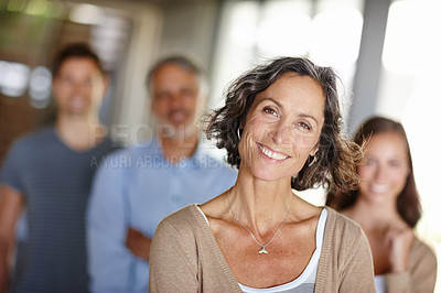 Buy stock photo Portrait of a happy mother with family standing behind her