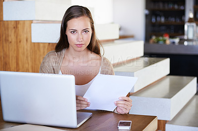 Buy stock photo Woman, research and home with paperwork or laptop in table for remote work as journalist. Portrait, female person and concentration in living room or lounge to browse internet  for information.