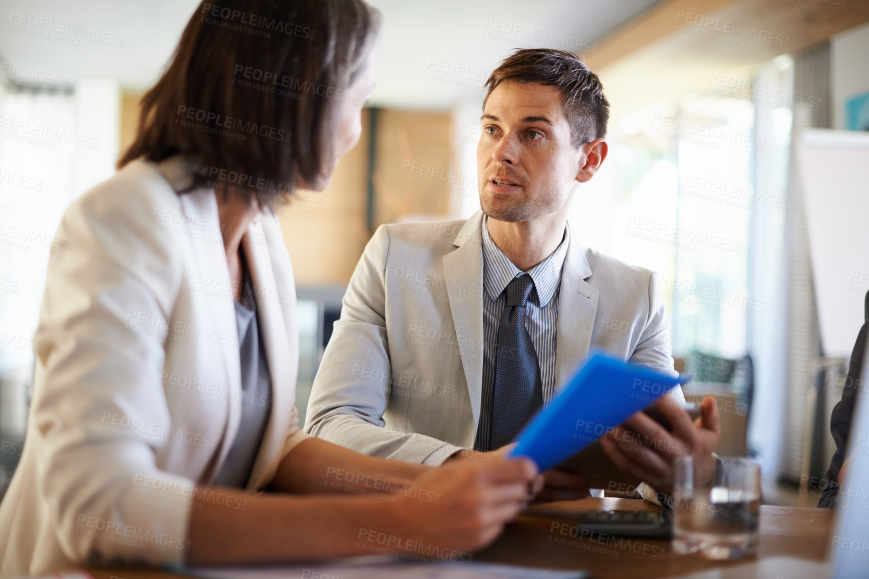 Buy stock photo Two businesspeople having an important discussion at a meeting