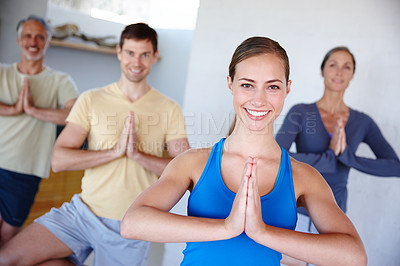 Buy stock photo People, yoga and gym with smile, fitness and wellness for mindfulness, wellbeing and health. Men, women and session at studio, class and together for physical, activity and training in Vrikshasana