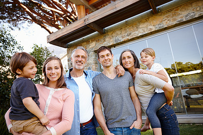 Buy stock photo Portrait, outdoor and happy big family together by home for love or bonding at backyard. Face, parents and smile of grandparents with kids at garden for connection with mother, father and children