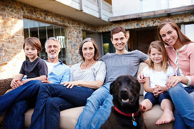 Buy stock photo Portrait, smile and family at house with dog outdoor together on sofa for love and bonding at backyard. Home, parents and happy grandparents with kids at garden to relax with mother, father and pet