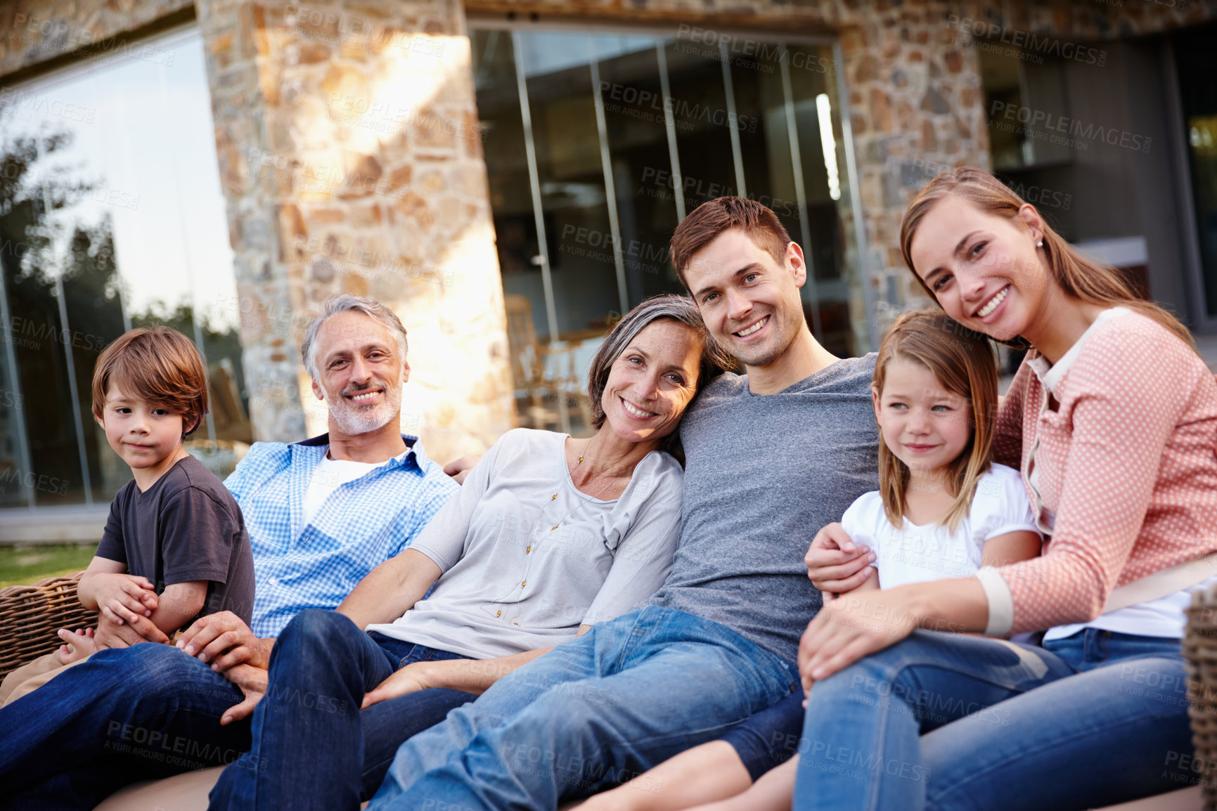 Buy stock photo Backyard, portrait and family with happiness, relax and sunshine with weekend break and fun. Garden, outdoor and grandparents with mother and father with children and kids with summer and vacation