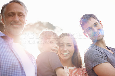 Buy stock photo Portrait, smile and family outdoor at park for love, bonding or together with lens flare of sunshine. Face, happy parents or kid at garden for connection with mother, father and grandfather in summer