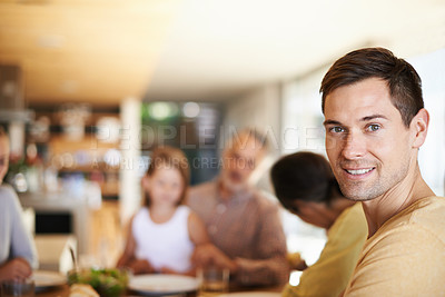 Buy stock photo Portrait, home and man with family for lunch, bonding and eating together at table with smile. Dining room, happy people and face of male person with food, celebration and thanksgiving in house