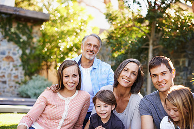 Buy stock photo Big family, happiness and portrait in backyard for love or bonding, care and memories together. Generations, garden and relax in summer for relationship growth or connection with unity and affection.