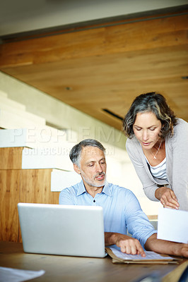 Buy stock photo Home, senior couple and laptop with documents, conversation and online reading with connection or planning for retirement. Apartment, computer or man with woman or tech with website info or paperwork