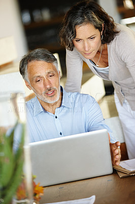 Buy stock photo Home, senior couple and laptop with conversation, love and online reading with connection and planning for retirement. Apartment, computer and man with woman and technology with website info or email