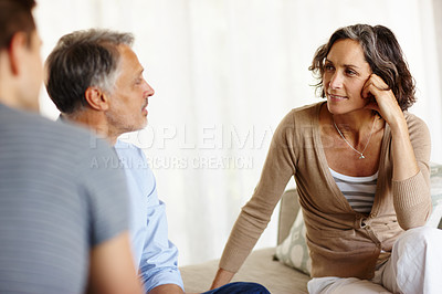 Buy stock photo Mature couple, sofa and smiling in house living room with discussion, communication and decision. Man, woman and consultant for retirement fund, advice and counselling on investment or annuity plan