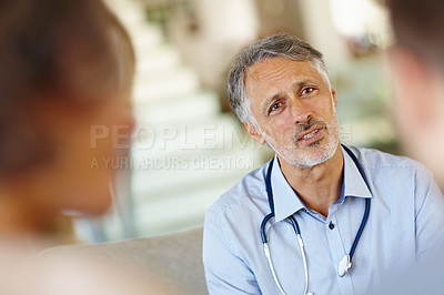 Buy stock photo Doctor, couple or stethoscope at infertility, consultation or meeting as empathy, news or support. Mature man, patients or medical appointment to report questions, survey or feedback by professional