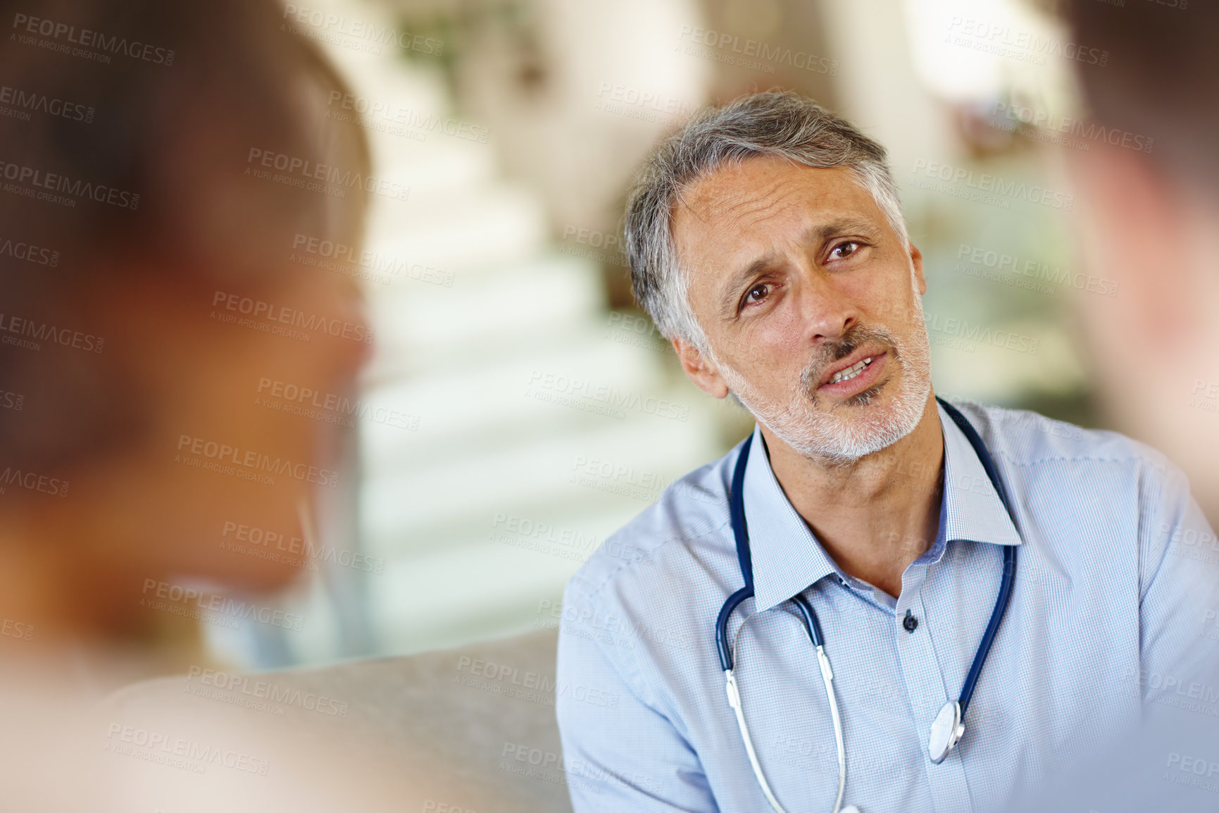 Buy stock photo Doctor, couple or stethoscope at infertility, consultation or meeting as empathy, news or support. Mature man, patients or medical appointment to report questions, survey or feedback by professional