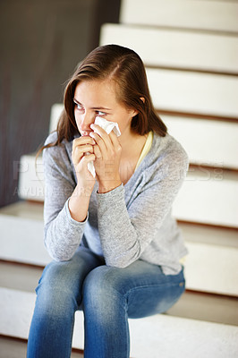 Buy stock photo Crying, stress or woman in house with tissue, depression or mental health, crisis or disaster. Stairs, overthinking or person with tears, anxiety or overwhelmed by fail, mistake or ptsd trauma memory