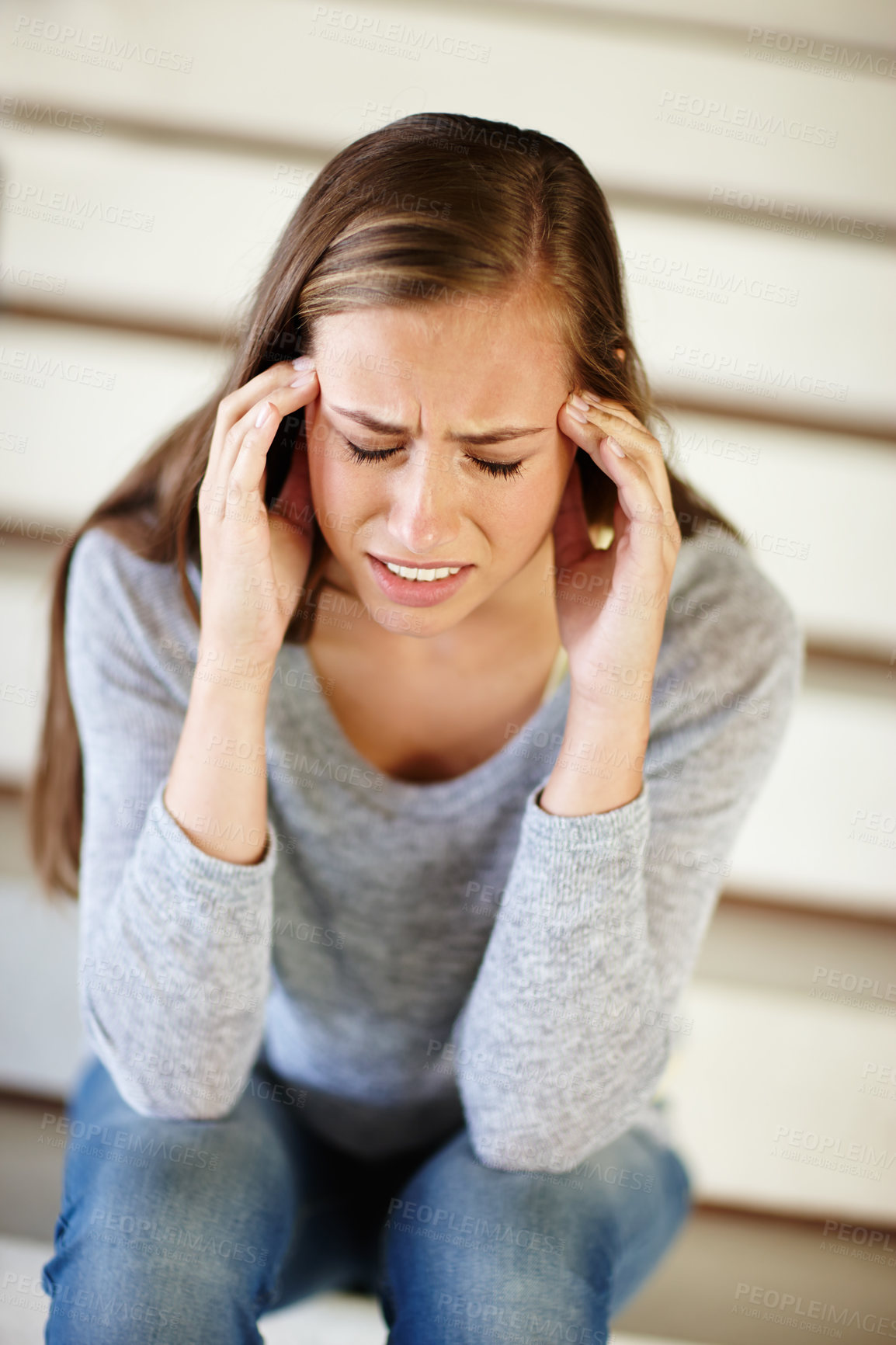 Buy stock photo Headache, anxiety and woman in house with stress, frustrated or mental health, crisis or disaster. Stairs, doubt or angry female person with broken heart overwhelmed by anxiety, fail or mistake