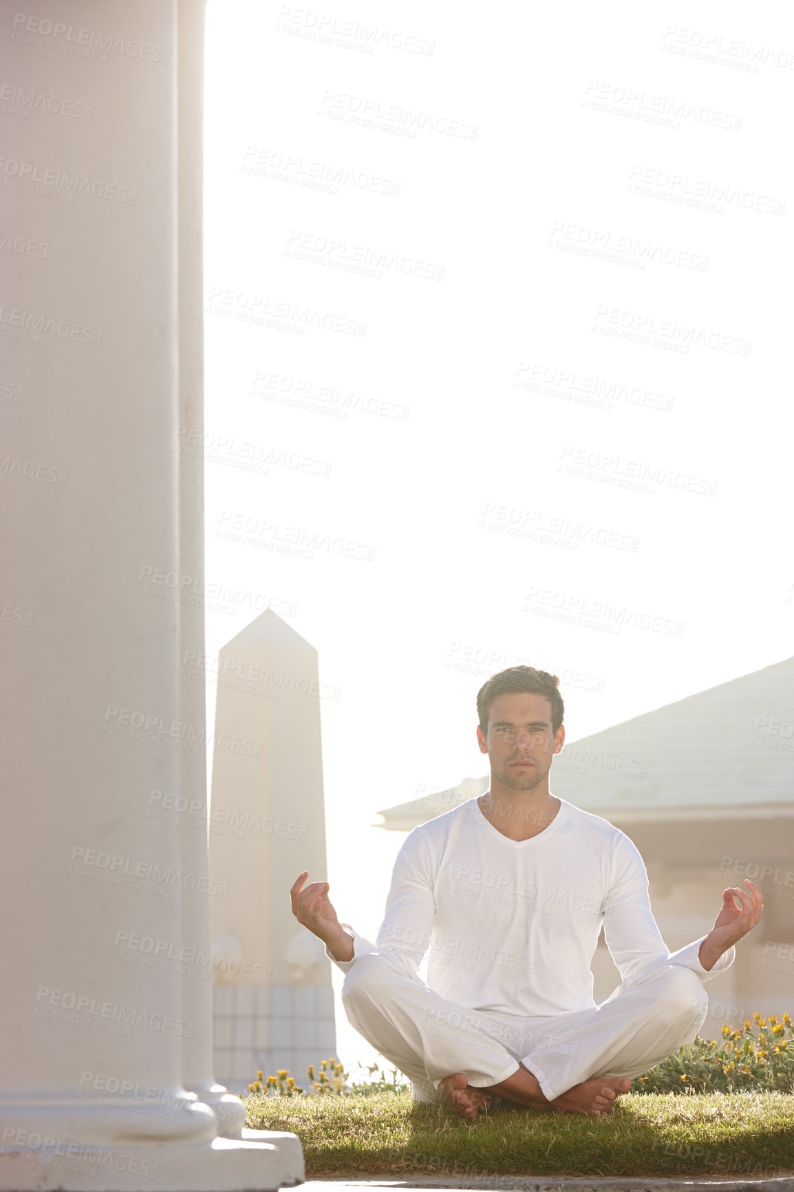 Buy stock photo Portrait, man or mindfulness as zen, meditation or practice as spiritual, health or peace in temple. Male yogi, grass or bright sky as pose, performance or balance in gratitude, worship or prayer