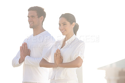 Buy stock photo Happy, prayer pose and couple at yoga retreat with smile, peace and relax with mindfulness at outdoor resort. Calm zen, man and woman with holistic health, spiritual wellness and namaste with hands