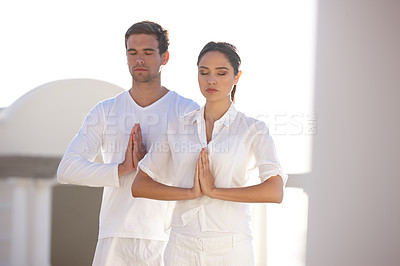 Buy stock photo Meditate, prayer pose and couple at yoga retreat with peace, relax and calm mindfulness at outdoor resort. Zen, man and woman together in holistic health, spiritual wellness and namaste with hands