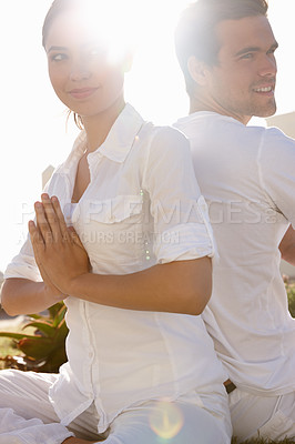 Buy stock photo Relax, prayer pose and couple at yoga retreat with smile, peace and meditate with mindfulness at outdoor resort. Zen, man and woman with holistic health, spiritual wellness and namaste with hands