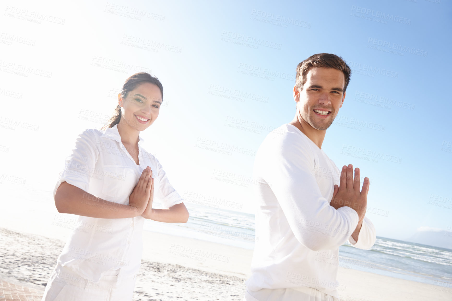 Buy stock photo Portrait, prayer pose and couple at beach for yoga retreat with smile, peace and relax in mindfulness. Zen, man and woman with meditate for holistic health, spiritual wellness and namaste at ocean