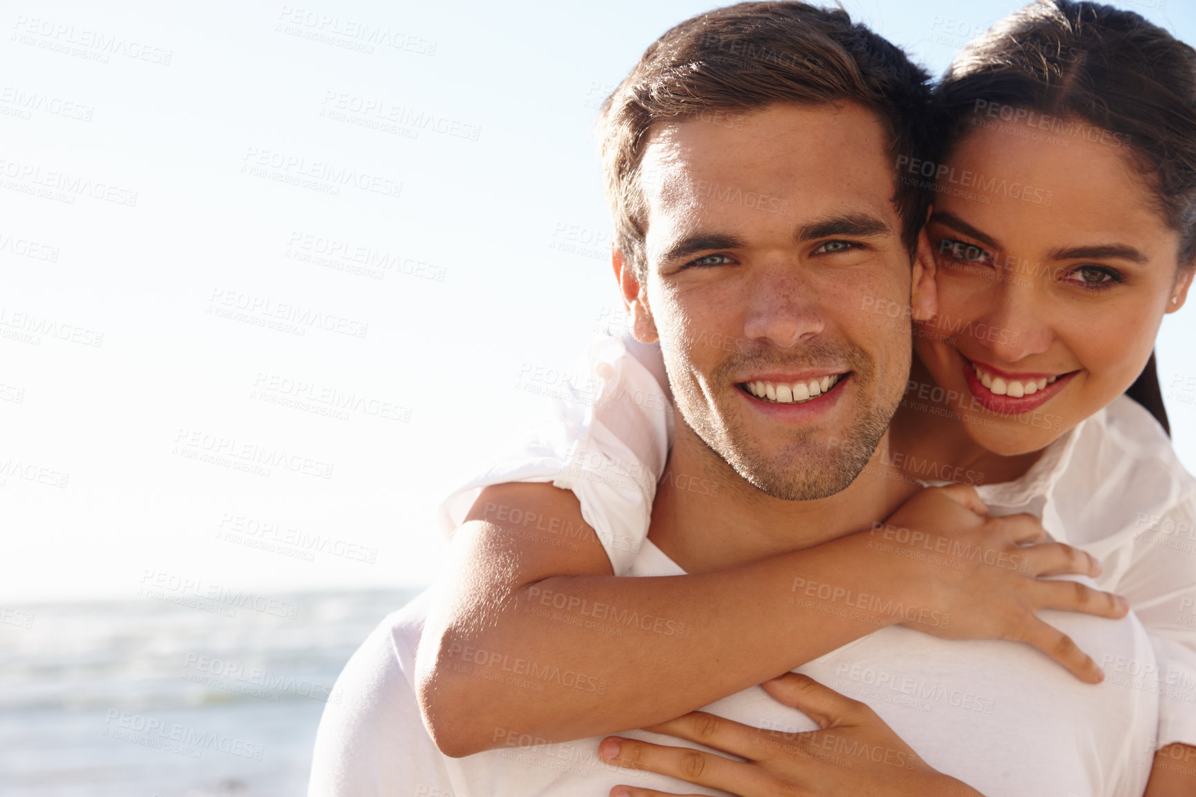 Buy stock photo Portrait, couple or piggyback on beach, date or romantic getaway in summer on mockup space. Happy, man or woman in hug to relax, care or love by ocean as bonding together on weekend break in Cancun