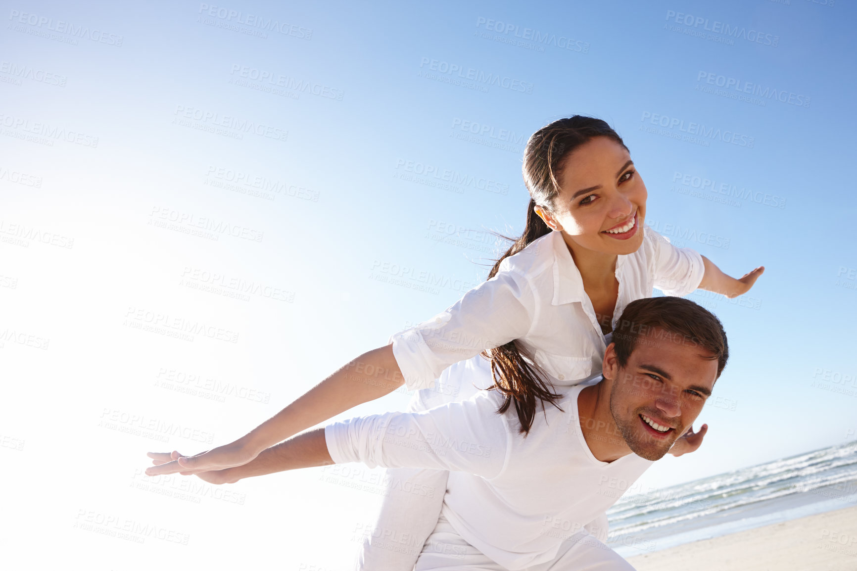 Buy stock photo Airplane, piggyback or happy couple on a beach for portrait or love with support, loyalty or outdoor freedom. Sky mockup space, romantic man or woman on holiday vacation to relax for wellness or care