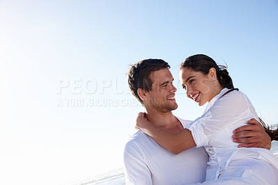 Buy stock photo Happy, carry and couple on beach in summer for bonding, relax together and relationship by ocean. Dating, travel and man and woman embrace for love on holiday, vacation or romantic weekend in nature