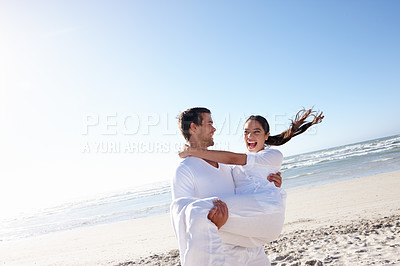 Buy stock photo Travel, carry or happy couple on a beach for vacation or love with support, loyalty or smile in outdoor nature. Sky mockup space, romantic man or woman on holiday to relax for wellness or anniversary