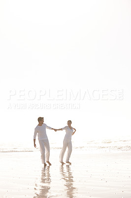 Buy stock photo Couple, ocean and holding hands for walk on beach, travel and commitment with trust and bonding outdoor. Love, care and support in relationship, honeymoon or anniversary with fun or playful in nature