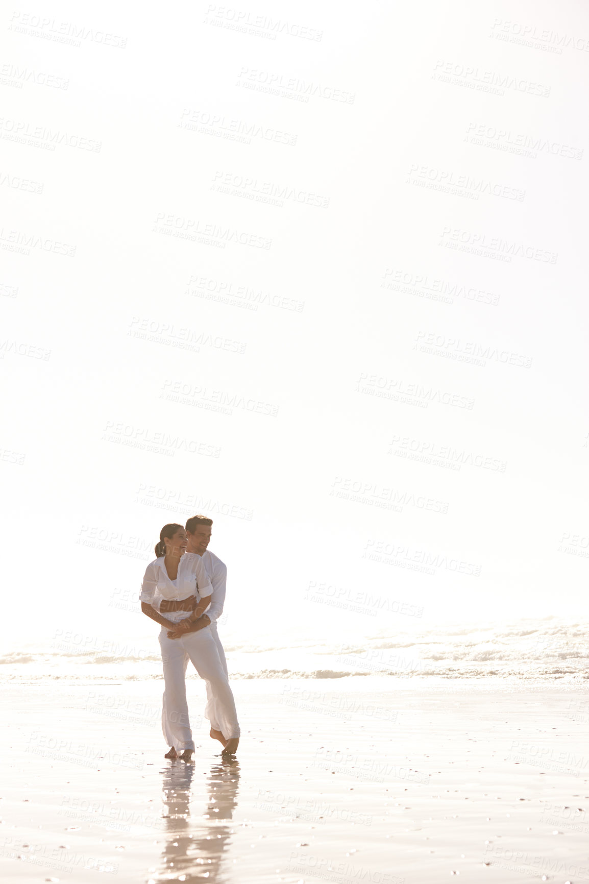 Buy stock photo Couple, hug and beach with love, vacation or summer holiday together for embrace or outdoor romance. Man and woman enjoying weekend or valentines day getaway by the ocean coast or sea on mockup space