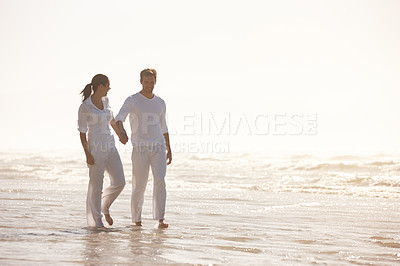 Buy stock photo Couple, ocean and holding hands on beach, travel and commitment with trust and bonding with walking outdoor. Love, care and support in relationship, honeymoon or anniversary with peace in nature