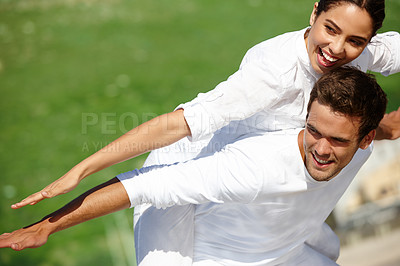 Buy stock photo Airplane, piggyback or happy couple in a park for vacation or love with support, loyalty or smile in outdoor freedom. Grass mockup space, romantic man or woman on holiday to relax for wellness or fun