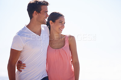 Buy stock photo Happy couple, hug and beach with embrace for love, care or romance on outdoor holiday in nature. Young man and woman with smile for weekend, vacation or getaway by the ocean coast, blue sky or mockup