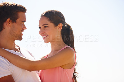 Buy stock photo Happy couple, beach and hug with love for embrace, care or support on outdoor holiday or vacation in nature. Man and woman with smile for relationship or weekend by ocean in happiness on mockup space