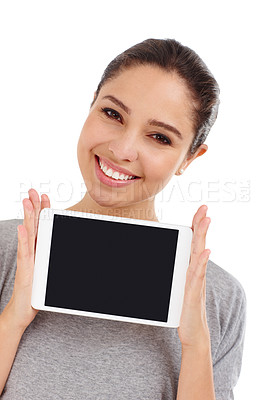 Buy stock photo Studio shot of an attractive young woman holding up a digital tablet