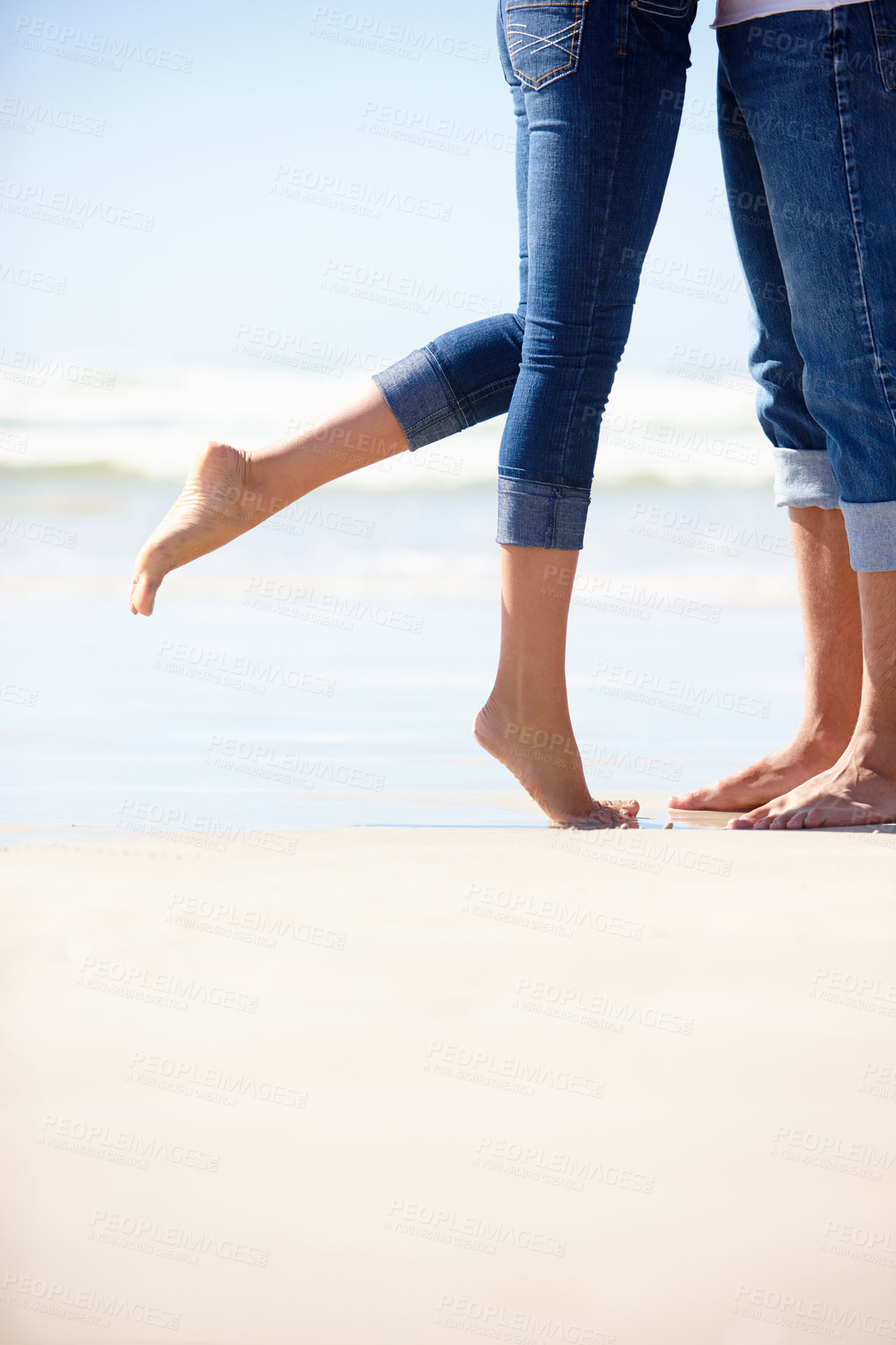 Buy stock photo Love, beach or couple feet in nature with hug, romance or adventure in nature closeup. Legs, zoom or people at ocean for travel, freedom and bonding on sea journey for anniversary, date or honeymoon