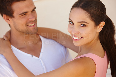 Buy stock photo Couple, portrait and happiness with hug by wall for healthy relationship, anniversary date and summer holiday. Support, man and woman with embrace, smile and affection for trust, comfort and care