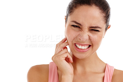 Buy stock photo Cropped shot of a beautiful young woman in physical pain standing in a studio-isolated on white 