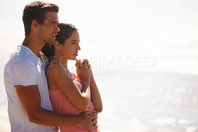 Buy stock photo Happy couple, embrace and ocean view for relax holiday or weekend date, beach or vacation. Man, woman and with hug for relationship getaway or calm summer for bonding connection, wellness or travel