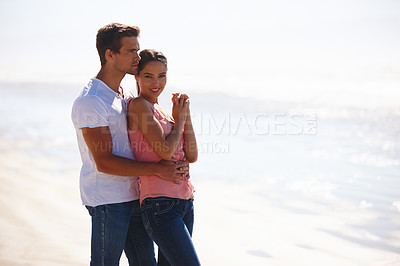 Buy stock photo Happy couple, beach and hug in relax with love for embrace, care or support on outdoor holiday or vacation in nature. Man and woman with smile for relationship or weekend by the ocean on mockup space