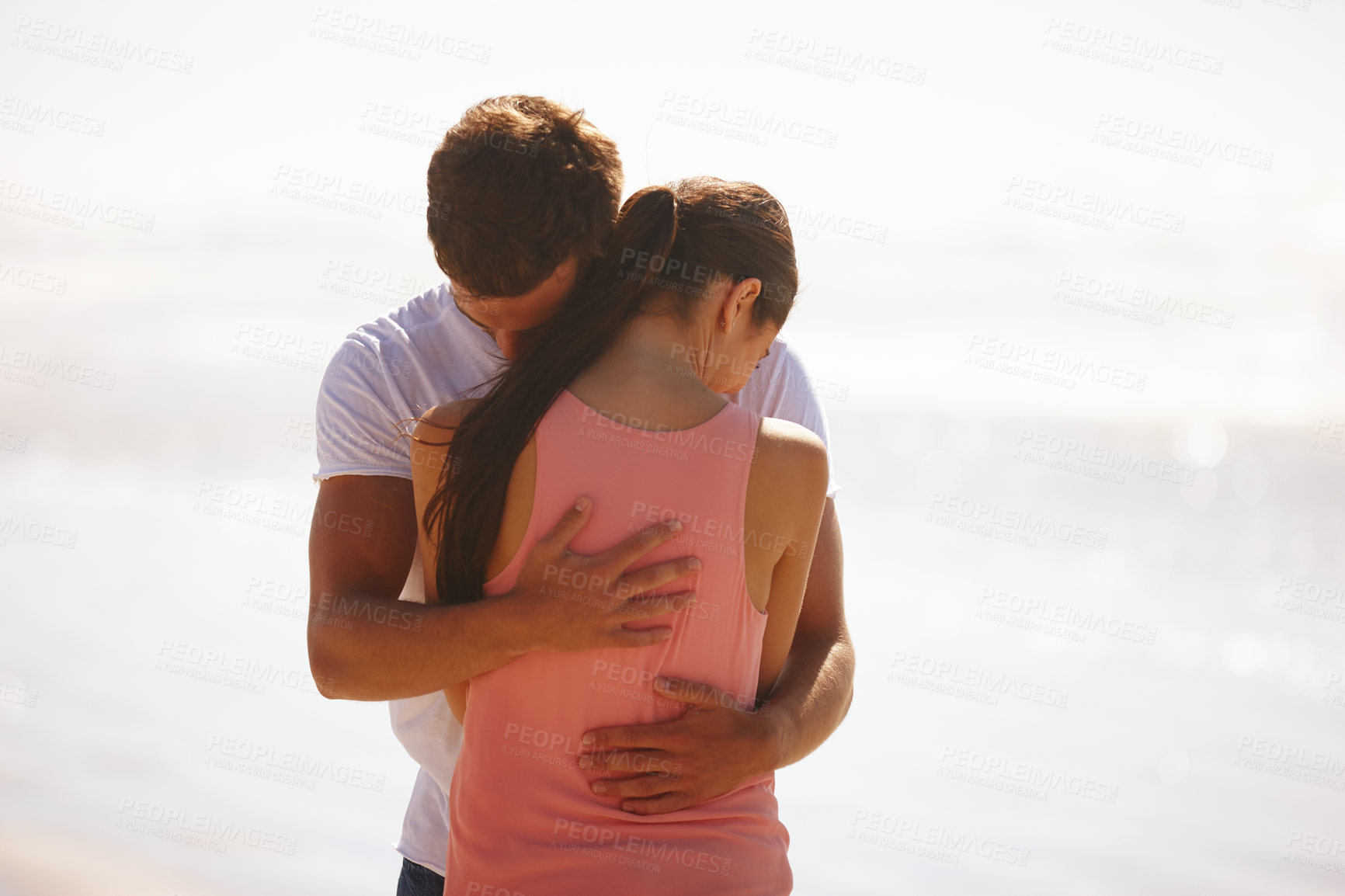 Buy stock photo Couple, hug and comfort at beach with love, woman and man with affection, care and time together outdoor. Safety, security and trust for comfort or support with kindness in relationship and embrace