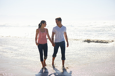 Buy stock photo Love, holding hands and couple at a beach walking, calm and bonding on ocean adventure together. Travel, sunset and people at sea with care, support and trust for summer, holiday or journey in nature