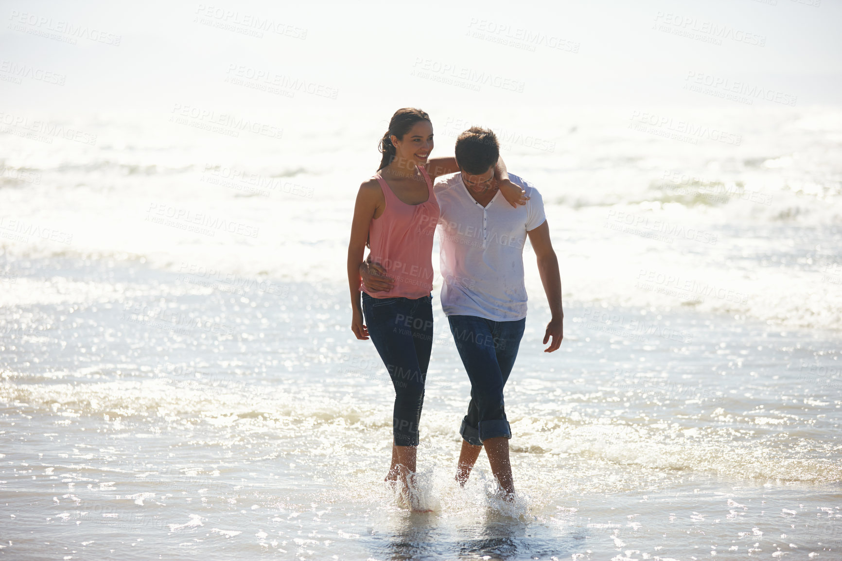 Buy stock photo Love, hug and couple at a beach walking, calm and bonding on ocean adventure together. Travel, sunset and people at sea embrace with care, support and trust for summer, holiday or journey in nature