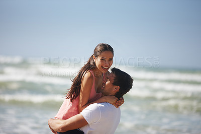 Buy stock photo Happy couple, hug and beach with embrace for love, care or support on holiday, weekend or outdoor vacation. Man lifting woman with smile for relationship, summer fun or bonding by the ocean coast