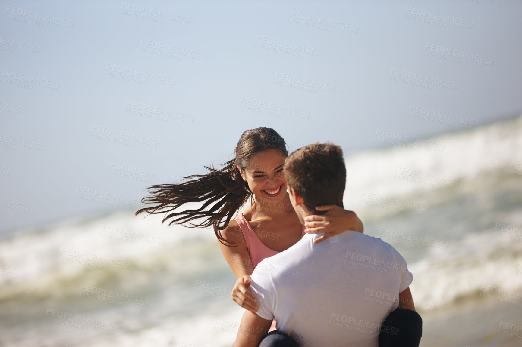 Buy stock photo Happy couple, hug and beach with romance for embrace, care or support on outdoor holiday or vacation in nature. Young man lifting woman in love, relationship or weekend by ocean coast on mockup space