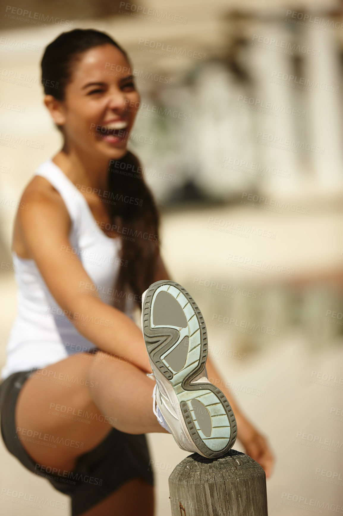 Buy stock photo Happy woman, fitness and stretching with leg in city for workout, exercise or outdoor training. Shoe of active female person or athlete in warm up, preparation or getting ready for challenge or run