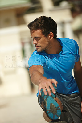 Buy stock photo Man, fitness and stretching with leg for workout, exercise or outdoor training in city. Active male person or young athlete in warm up, preparation or getting ready for challenge or run in urban town