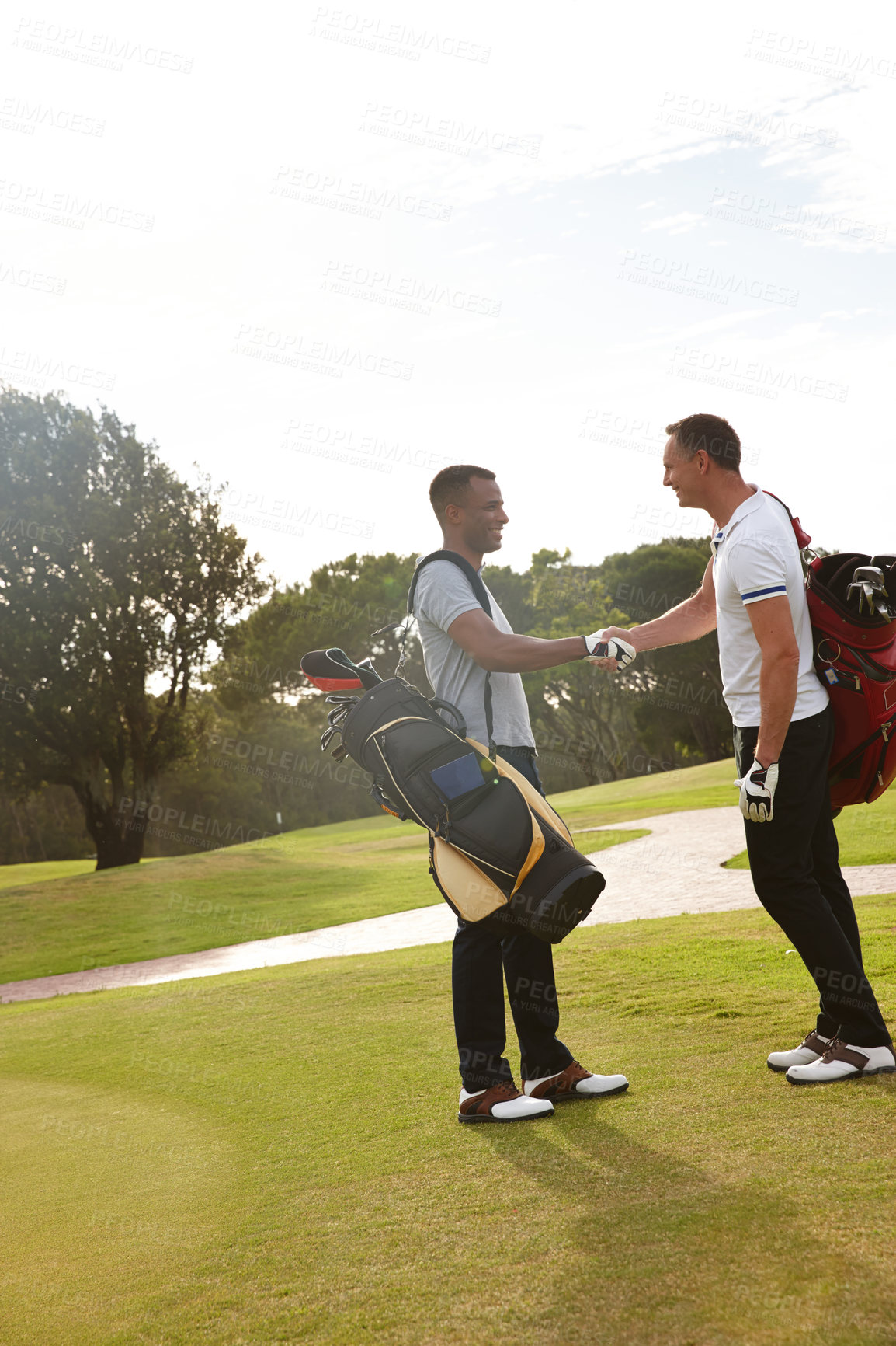 Buy stock photo Happy man, friends and handshake with golfer on green grass for teamwork, match or outdoor game. Young male person or people shaking hands for friendly sport or competition together on golf course