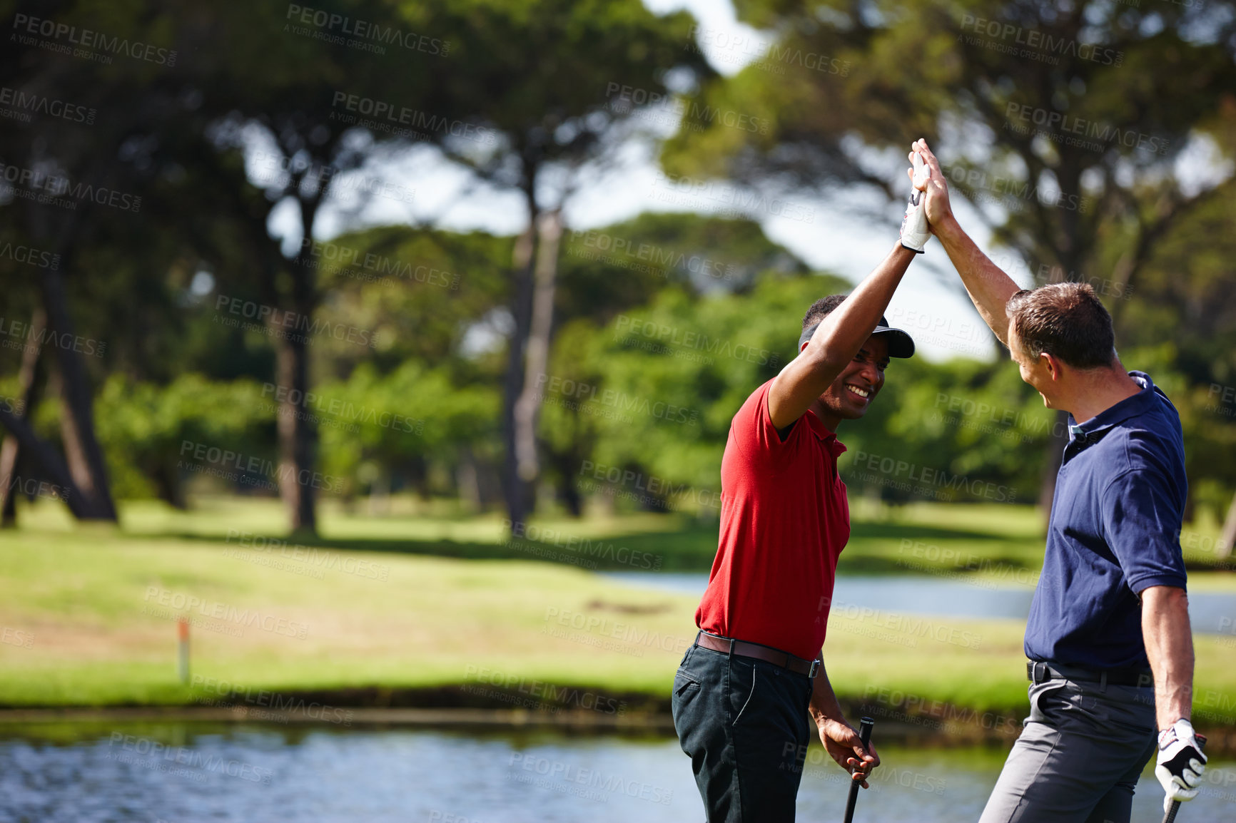 Buy stock photo Excited man, high five and celebration with golf course for winning, point or score in outdoor nature. Male person, friends or people touching with smile for teamwork, victory or match on grass field