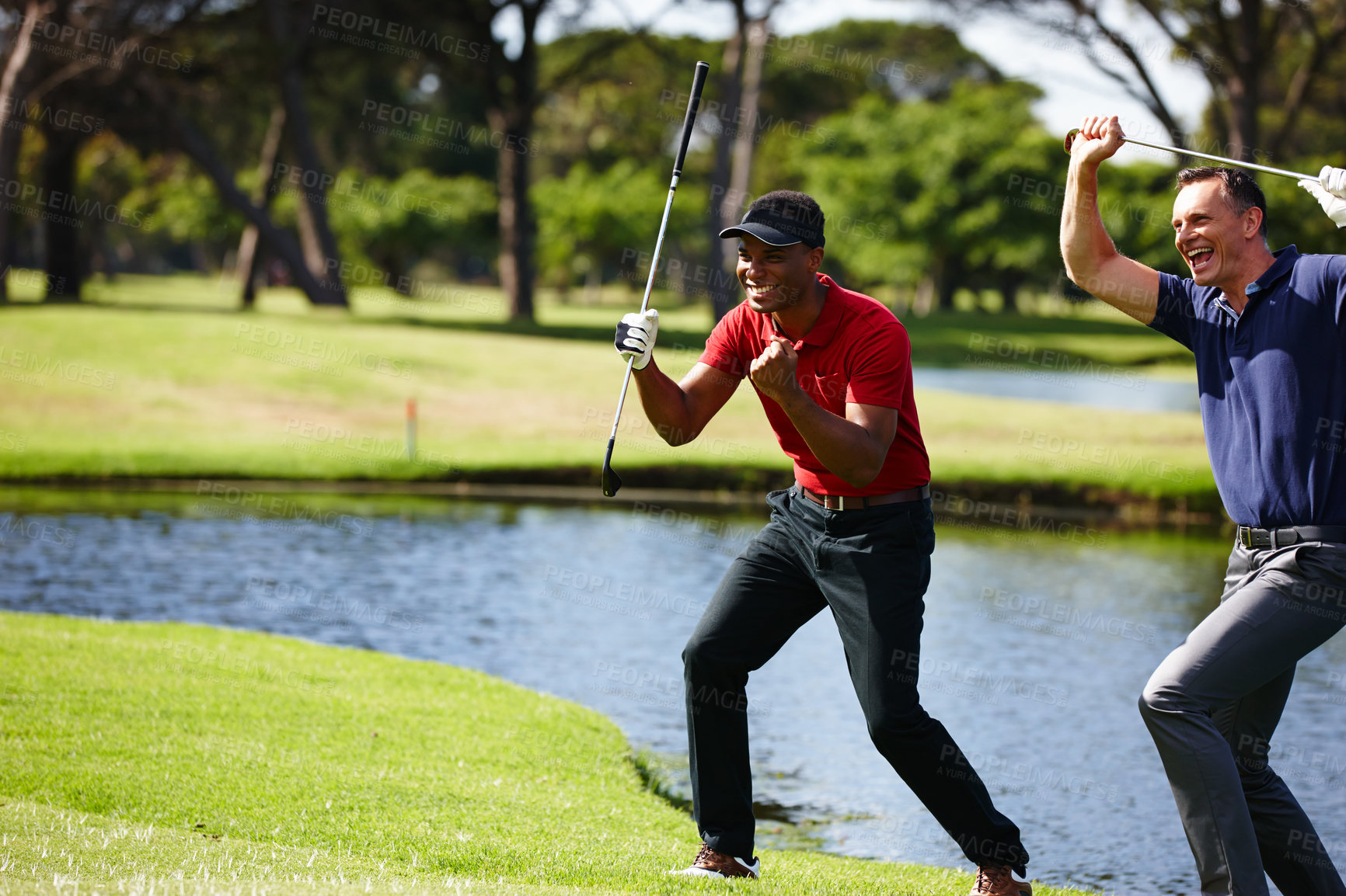 Buy stock photo Shot of two golfers celebrating a great shot